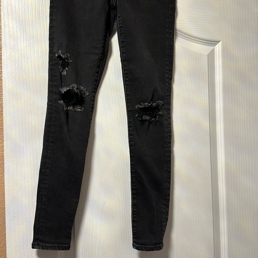 American Eagle black skinny stretch distressed jeans size 2